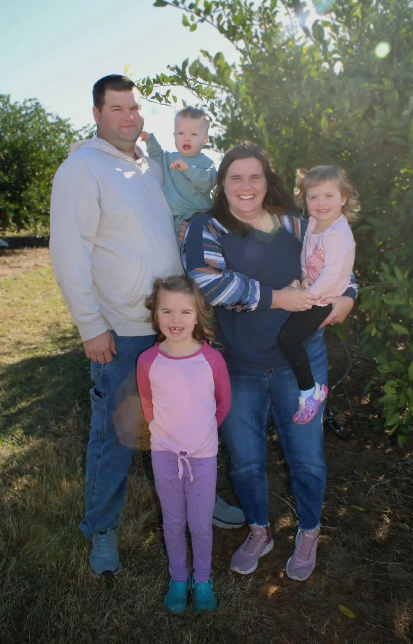Corey with his family outdoors in Wabash County